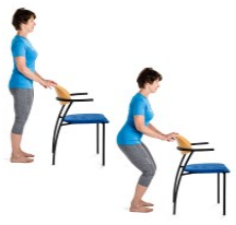 Woman standing behind a chair and holding it lightly with both hands. On the right of this, the same woman is standing behind the chair squatting down whilst still holding onto the back of the chair.